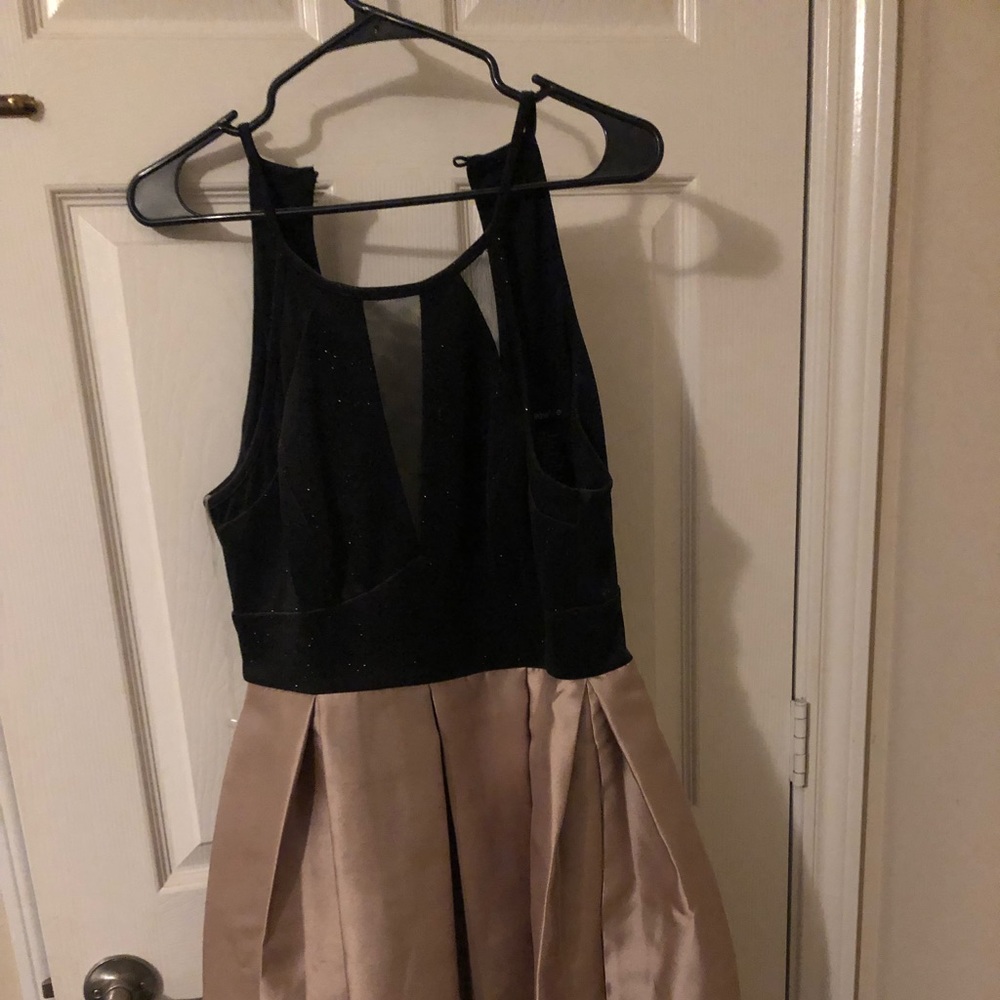 A black gold prom dress never been used